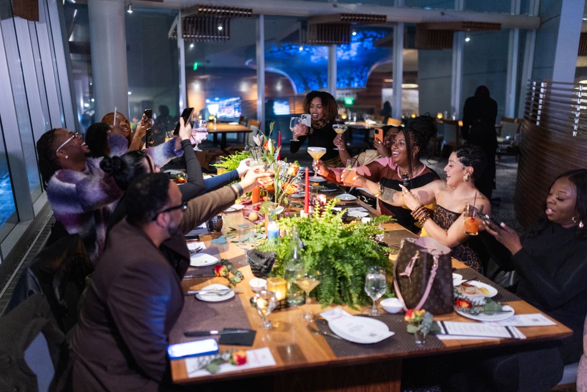 Creators toasting together at a Detroit dinner